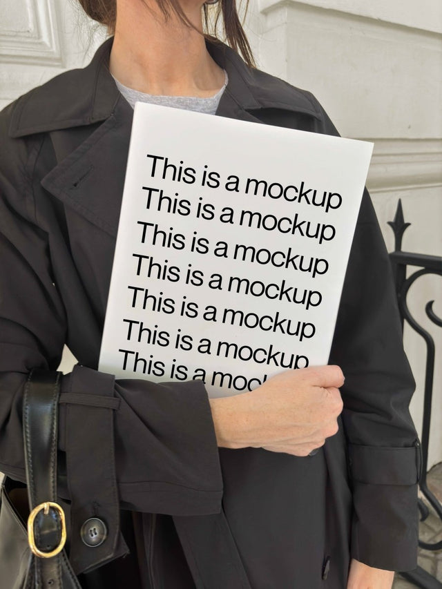 Holding Magazine with Trench Coat Mockup - Mock Exchange