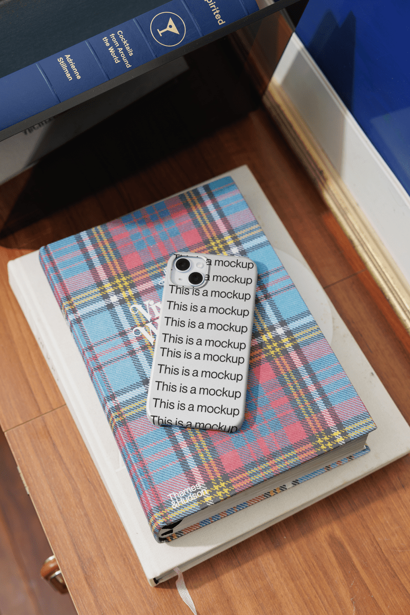 iPhone Case Mockup on Book - Mock Exchange