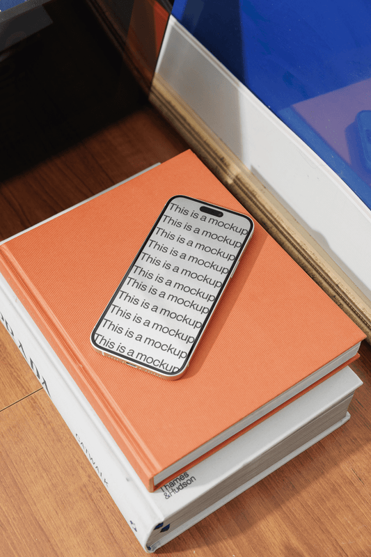 iPhone Mockup on Book - Mock Exchange
