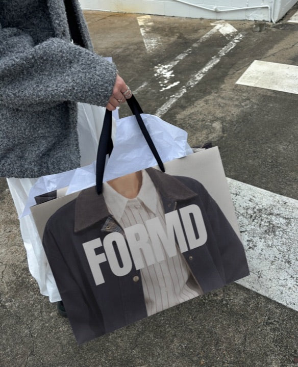 A shopping bag printed with a design, a real Mock Exchange mockup