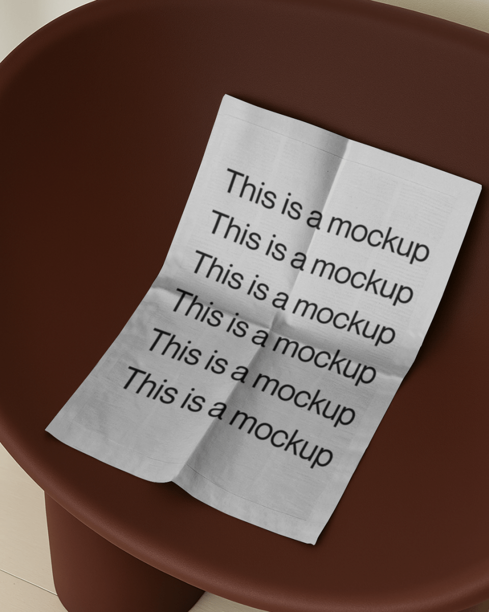 Newspaper on Burgundy Chair - Mock Exchange