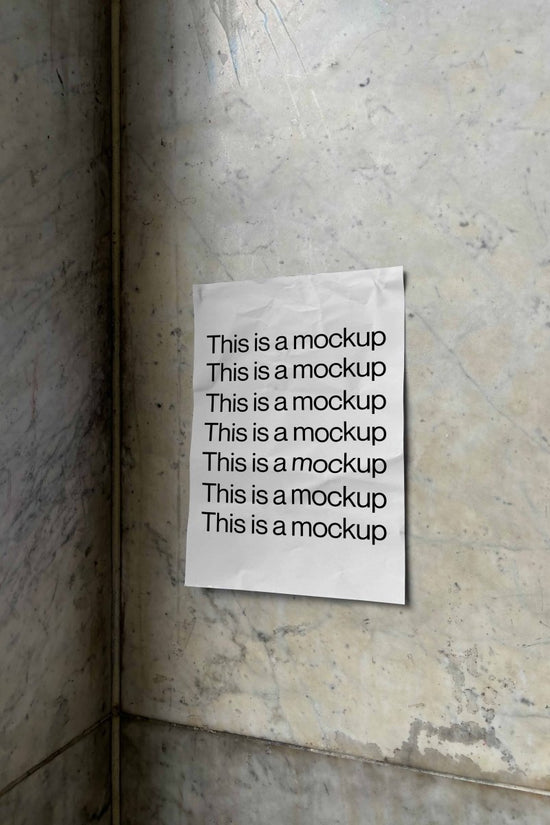 Poster Crumpled on Marble Wall Mockup - Mock Exchange