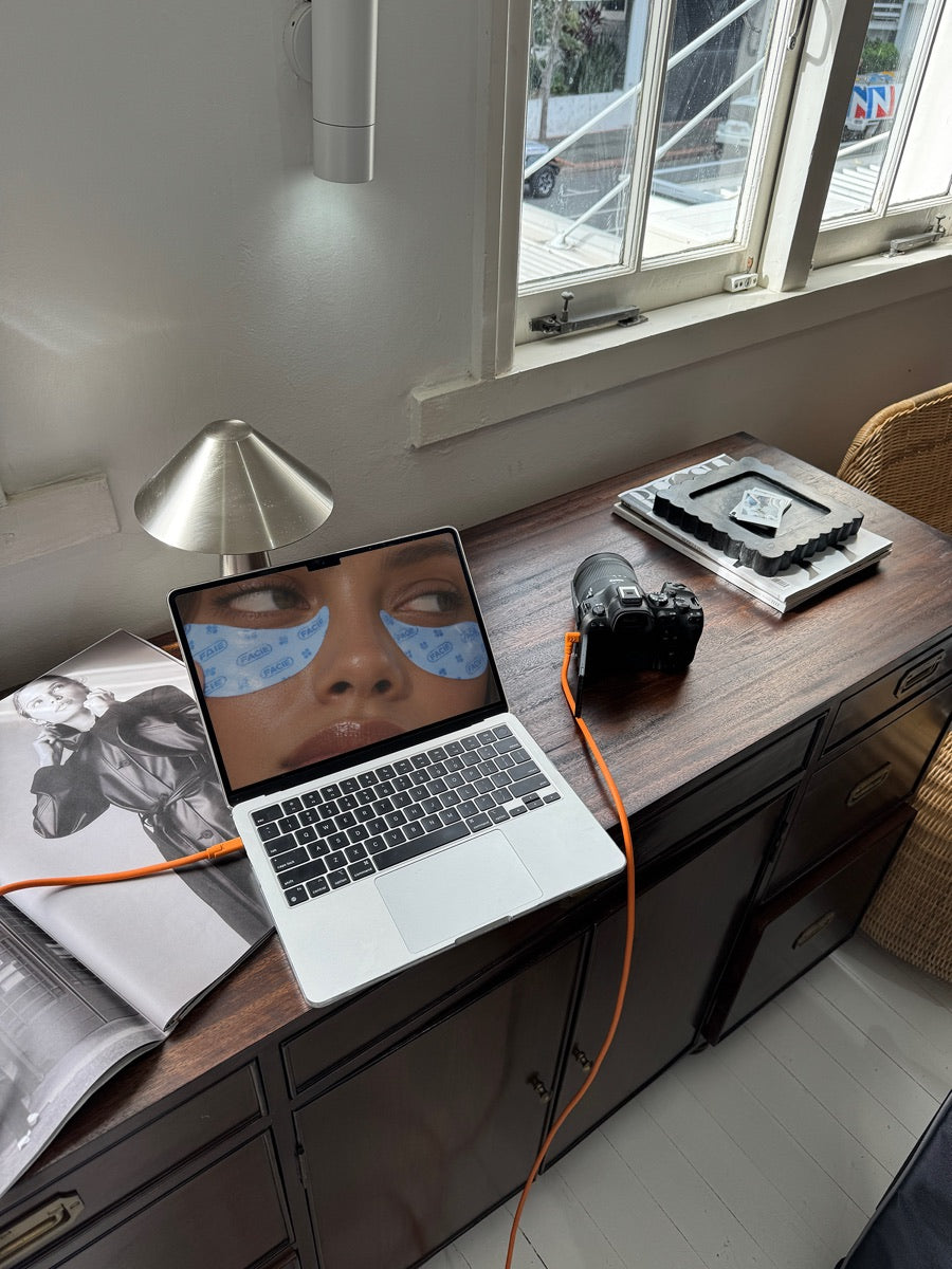 A logo on a real photo of a laptop in use