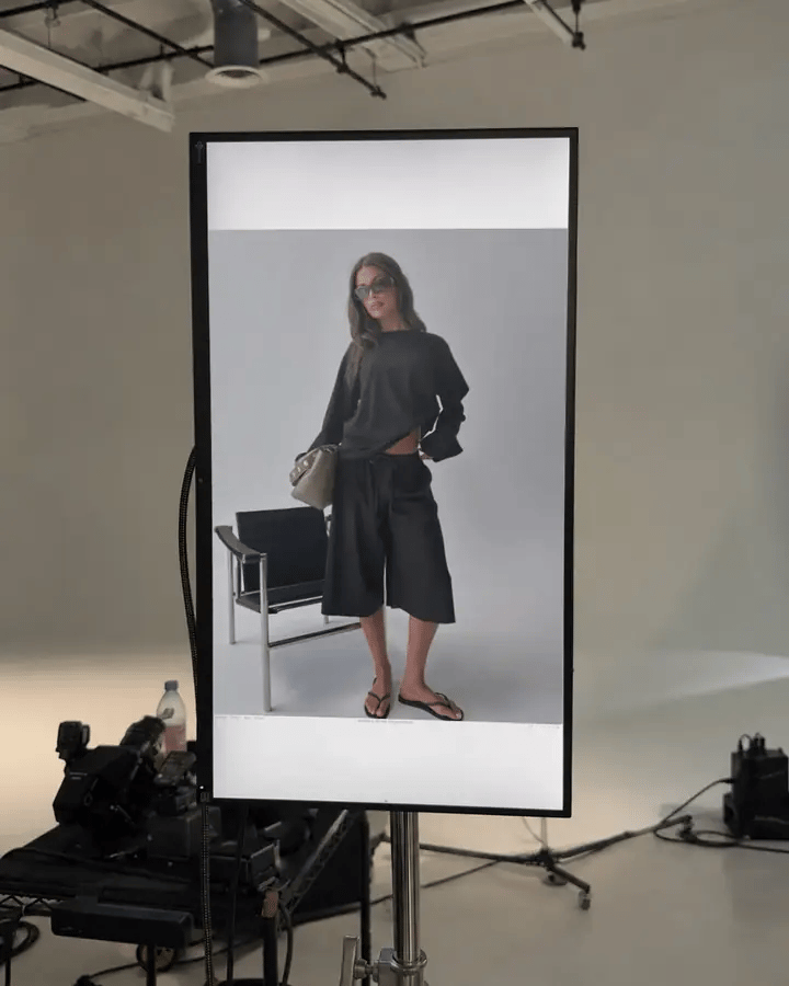 Photos changing one after another on a screen in a photo studio